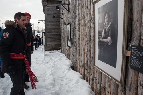 Mike Deal / Winnipeg Free Press Officials were invited to check out the grounds of the Festival du Voyageur the day before it's official opening and to have a look at the outdoor exhibition curated by the CMHR, Let Them Howl: 100 Years in the Women's Rights Struggle. Winnipeg Mayor Brian Bowman checks out the large portrait of Nellie McClung hung on the outside of Fort Gibraltar as part of the CMHR exhibit. 160211 - Thursday, February 11, 2016