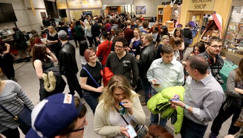 People waiting in the foyer during Safari Night at the Manitoba Museum, where people were taking guided tours with photography tips, Thursday, February 11, 2016. (TREVOR HAGAN/WINNIPEG FREE PRESS)