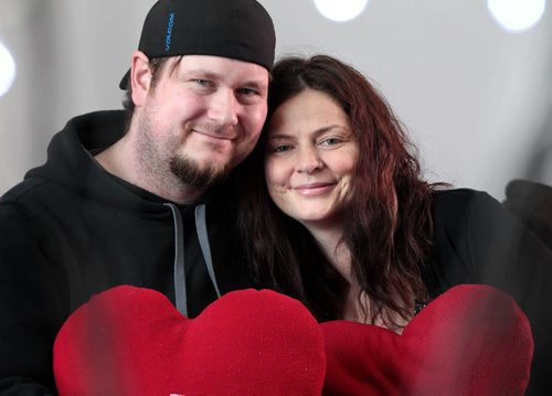 Sherene Wright and Russell MacDougall, both heart transplant recipients, cuddle together at their home holding heart-shaped pillows made by volunteers for St. Boniface Hospital heart surgery patients.  Portraits taken for Valentine's Day story on how heart patient couple met in the cardiac intensive care unit and now are getting married in September.    See Kevin Rollason  | Reporter February 11, 2016 Ruth Bonneville / Winnipeg Free Press