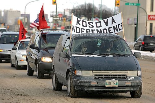 BORIS MINKEVICH / WINNIPEG FREE PRESS  080217 Winnipeg's Portage Ave. with Kosovo happy people.