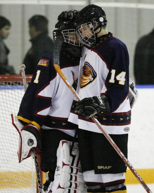 John Woods / Winnipeg Free Press / February 17, 2008 - 080217 - Winnipeg Thrashers Joey Rewucki (1) and Mark Stone (14) embrace after defeating the Eastman Selects in Midget AAA hockey action at Gateway Arena Sunday February 17, 2008.   The Thrashers defeated the Selects ending the season with a perfect 40-0 record.