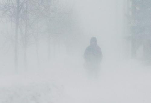 John Woods / Winnipeg Free Press / February 17, 2008 - 080217 - Allison Veness makes her way through whiteout conditions on Jefferson this morning Sunday February 17, 2008.