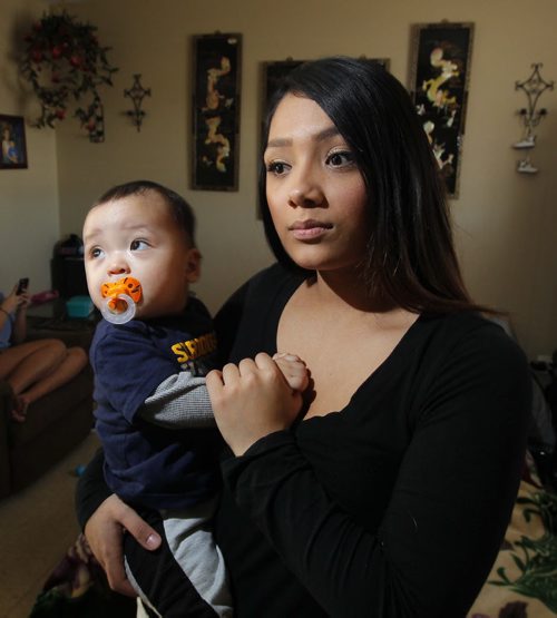 Caley Fawcett is a 17-year-old mom who was allegedly assaulted by transit bus driver. It was a she-said, she-said until video surveillance proved the bus driver had allegedly assaulted Fawcett first, and she defended herself. The bus driver has been suspended. In this photo Caley holds her 8 month old son Jharrell Faucett-Ramirez. BORIS MINKEVICH / WINNIPEG FREE PRESS February 12, 2016