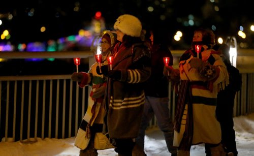 A candle and torch lit march from the Canadian Museum for Human Rights to the St.Boniface Cathedral, to mark the opening of the Festival du Voyageur, Friday, February 12, 2016. (TREVOR HAGAN/WINNIPEG FREE PRESS)