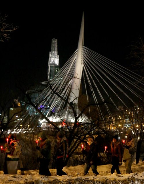 A candle and torch lit march from the Canadian Museum for Human Rights to the St.Boniface Cathedral, to mark the opening of the Festival du Voyageur, Friday, February 12, 2016. (TREVOR HAGAN/WINNIPEG FREE PRESS)