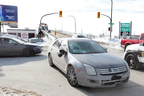 Police at the scene of a accident involving a pedestrian at the corner of Arlington and Dufferin Ave. Saturday.  Victim was sent to hospital in serious condition.     February 13, 2016 Ruth Bonneville / Winnipeg Free Press  MVC