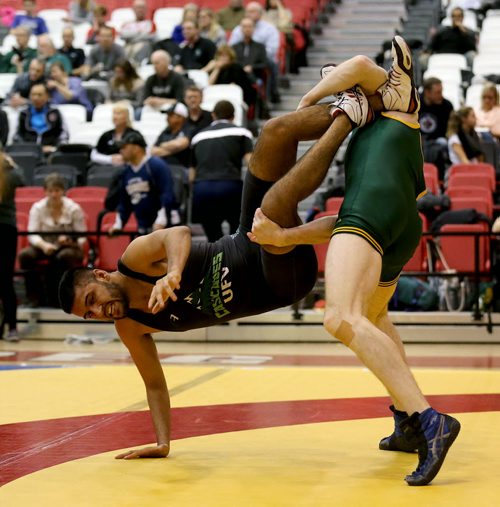 University of Regina's Gaelan Malloy, right, defeats University of Fraser Valley's Devin Purewall, during wresting during the Canada West Wrestling Championships at the University of Winnipeg, Saturday, February 13, 2016. (TREVOR HAGAN/WINNIPEG FREE PRESS)