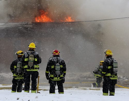 Firefighters on the scene of a fire at El Dorado Trading Centre, on the 400 block of St.Mary's Road, Sunday, February 14, 2016. (TREVOR HAGAN/WINNIPEG FREE PRESS)