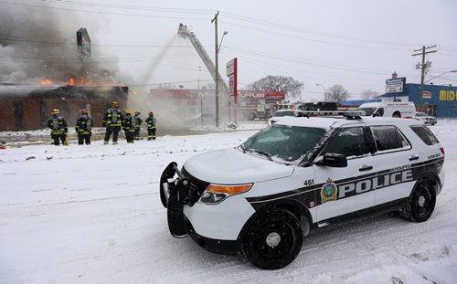 Firefighters on the scene of a fire at El Dorado Trading Centre, on the 400 block of St.Mary's Road, Sunday, February 14, 2016. (TREVOR HAGAN/WINNIPEG FREE PRESS)