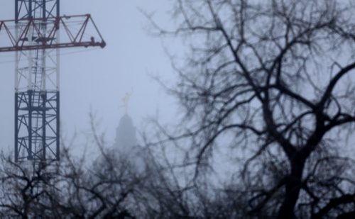 The Golden Boy, barely visible through a snow storm this morning, as seen from the Midtown Bridge, Sunday, February 14, 2016. (TREVOR HAGAN/WINNIPEG FREE PRESS)