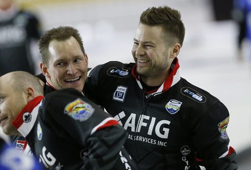 February 14, 2016 - 160214  -  Mike McEwen (R) and Denni Neufeld celebrate after defeating Matt Dunstone at the 2016 mens provincial championships in Selkirk Sunday, February 14, 2016. John Woods / Winnipeg Free Press