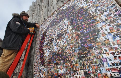 Mike Deal / Winnipeg Free Press Colin Mackie with the Festival du Voyageur hangs the Louis Riel Family Mosaic onto the walls of Fort Gibraltar. Created by photos sent to the Festival by the general public the giant Louis Riel Family Mosaic was unveiled on Louis Riel Day.  160215 February 15, 2016