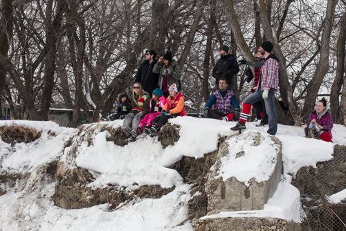 Mike Deal / Winnipeg Free Press Crowds line the banks of the Red River to watch the first annual Wild Winter Canoe Race at The Forks on Louis Riel Day. 160215 - Monday, February 15, 2016