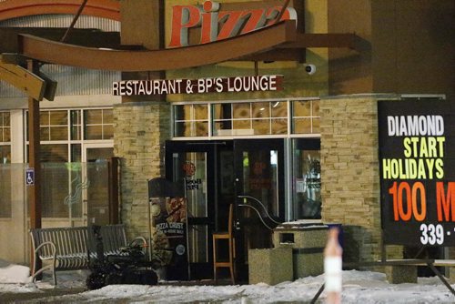 February 15, 2016 - 160215  -  Police robot enters a Boston Pizza on McPhillips to investigate a suspicious package Monday, February 15, 2016. The robot shot the package to dispose of it. Police were called to the restaurant for a robbery and a suspected package was found at the scene. John Woods / Winnipeg Free Press
