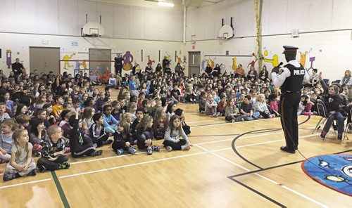 Canstar Community News Winnipeg police chief Devon Clunis spoke to students at Springfield Heights School (505 Sharon Bay) on the themes of "wisdom and courage" on Mon., Feb. 8. (SHELDON BIRNIE/CANSTAR/THE HERALD)