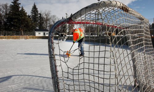 JOE BRYKSA / WINNIPEG FREE PRESS Manitou, Manitoba, Claire Jago cleans the ice on the Pembina Manitou outdoor rink, February 16, 2016.( See Randy Turner rural hockey rinks 49.8 story)