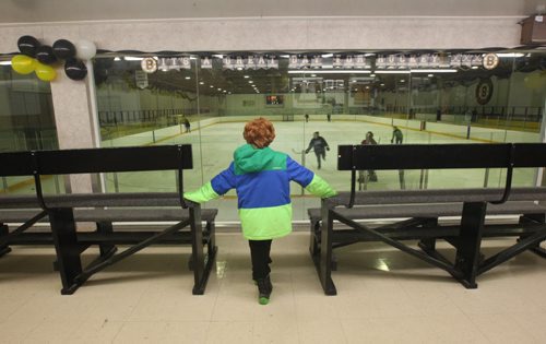 JOE BRYKSA / WINNIPEG FREE PRESS Pierson, Manitoba, Pierson, Manitoba- Rohan Pettinger watches action inside the arena after a long skate, February 16, 2016.( See Randy Turner rural hockey rinks 49.8 story)