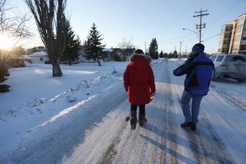 JOHN WOODS / WINNIPEG FREE PRESS Laresa Sayles and Joe Nemeth, relatives of Cooper Nemeth, go door to door with hundreds of volunteers who gathered at Gateway Recreation Centre to search for Nemeth Tuesday, February 16, 2016. Cooper Nemeth was last seen early Sunday morning at a party in Valley Gardens.