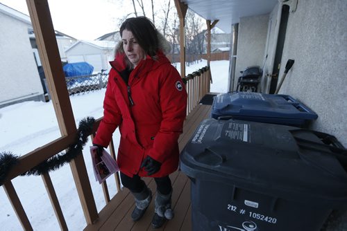 JOHN WOODS / WINNIPEG FREE PRESS Laresa Sayles, aunt of Cooper Nemeth, goes door to door with hundreds of volunteers who gathered at Gateway Recreation Centre to search for Nemeth Tuesday, February 16, 2016. Cooper Nemeth was last seen early Sunday morning at a party in Valley Gardens.