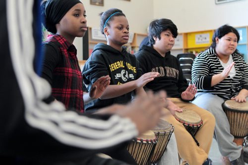 Ruth Bonneville / Winnipeg Free Press A broad spectrum of students from refugees to indigenous  Canadians learn to drum together at General Wolfe School Tuesday morning.  Photos to go with Carol Saunders story on EAL class for newcomer kids  learning English as a second language and integrating themselves into the public school system.