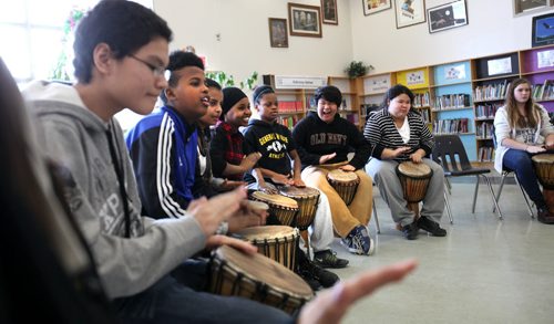 Ruth Bonneville / Winnipeg Free Press A broad spectrum of students from refugees to indigenous  Canadians learn to drum together at General Wolfe School Tuesday morning.  Photos to go with Carol Saunders story on EAL class for newcomer kids  learning English as a second language and integrating themselves into the public school system.