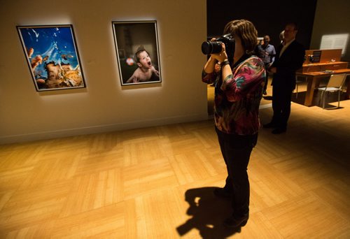 MIKE DEAL / WINNIPEG FREE PRESS Blind photographer Tara Miller takes photos for the CMHR's opening reception for their new exhibit Site:Unseen.  See Ashley Prest story 160217 - Wednesday, February 17, 2016