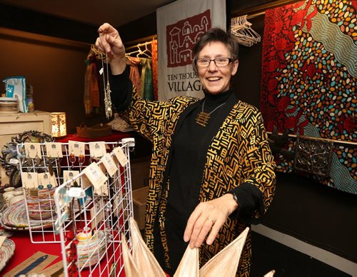 JASON HALSTEAD / WINNIPEG FREE PRESS Kathy Fast stocks the Ten Thousand Villages pop-up shop at the Manitoba Council for International Cooperation's Globally Speaking: Stories of Development event on Feb. 10, 2016, at the Park Theatre. The event focused on international development, how it affects people around the world and what really transpires when we engage as a global community. (See Social Page)