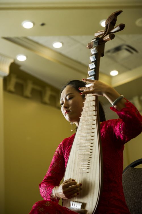 DAVID LIPNOWSKI / WINNIPEG FREE PRESS 160218  Ruyu Zhao of The Guizhou Culture Exchange Performing Arts Troupe plays the Pei Pa at the Best Western Plus Winnipeg Airport Hotel Thursday February 18, 2016.  The media got a sneak peek of the 2016 Chinese New Year Celebration Show (hosted by Manitoba Great Wall Performing Arts) which featured acrobatics, dance and musical performances. The show is on February 20, 2016, 7 PM, at the Pantages Playhouse Theatre.