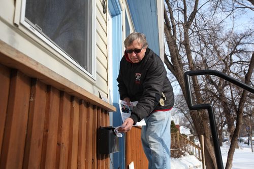 Ruth Bonneville / Winnipeg Free Press Father and grandfather, Ray Smylski, volunteers to drop off flyers containing information on missing teen, Cooper Nemeth, along Enfield Cresent Thursday afternoon.   See Jen Zoratti story.  Feb 18, 2016