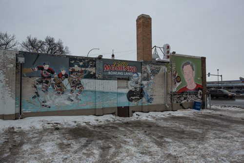MIKE DEAL / WINNIPEG FREE PRESS The decaying mural on the south side of the Billy Mosienko Bowling Lanes on Main Street. 160218 - Thursday, February 18, 2016