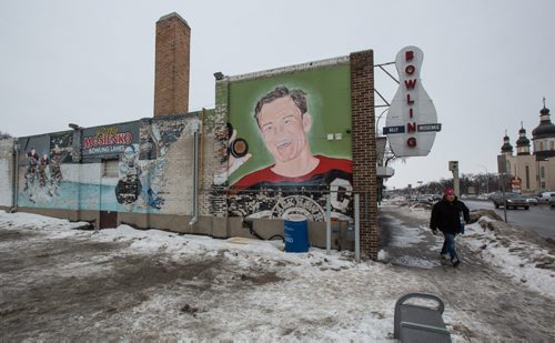 MIKE DEAL / WINNIPEG FREE PRESS The decaying mural on the south side of the Billy Mosienko Bowling Lanes on Main Street. 160218 - Thursday, February 18, 2016