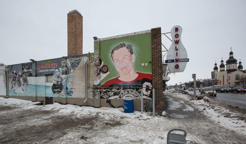MIKE DEAL / WINNIPEG FREE PRESS The decaying mural on the south side of the Billy Mosienko Bowling Lanes on Main Street. 160218 - Thursday, February 18, 2016
