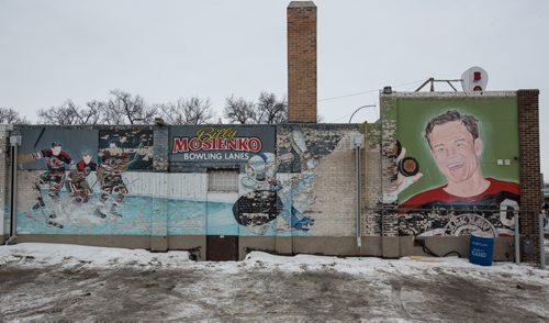 MIKE DEAL / WINNIPEG FREE PRESS The decaying mural on the south side of the Billy Mosienko Bowling Lanes on Main Street. 160218 - Thursday, February 18, 2016