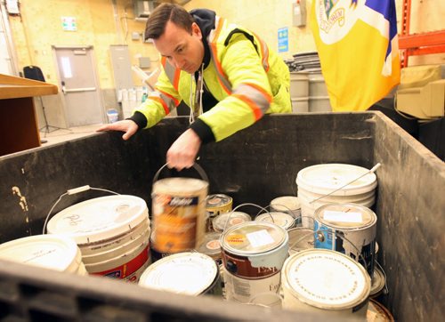 JOE BRYKSA / WINNIPEG FREE PRESSSimon Strauman of the City of Winnipeg shows paint bin inside new Household Hazardous and Special Waste depot at the Brady landfill that will let Winnipegers drop off recyclables and hazardous waste for free , February 18, 2016.( See Aldo story)
