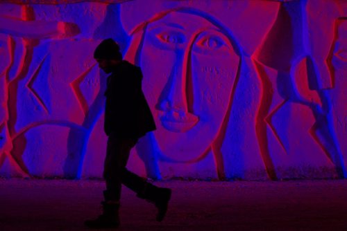 MIKE DEAL / WINNIPEG FREE PRESS Beautifully lit snow sculptures abound at the Festival du Voyageur on Thursday where temperatures hovered around 2C well into the night. 160218 - Thursday, February 18, 2016