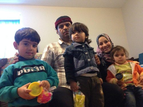 CAROL SANDERS / WINNIPEG FREE PRESS  Syrian refugees Yahia Alsabsabi, his wife Najah Alzoubi, (left to right) their son Zakariya, four, and 3-year-old twins Waleed and Aseel - missing from photo are 18-month-old twins Huda and Hadeel who were napping. The family arrived in Winnipeg Feb. 10 and Yahia the dad took part in a safety program for parents Feb. 11 at their temporary housing unit downtown. For Feb. 19 Saturday Special.