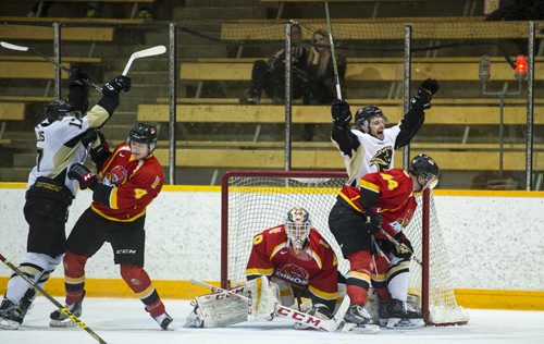 DAVID LIPNOWSKI / WINNIPEG FREE PRESS  University of Manitoba Bisons Joel Schreyer (#23) celebrate his teams second period goal against University of Calgary Dinos Friday February 19, 2016 at Wayne Fleming Arena at Max Bell Centre. This is the first game in the Canada West Quarter Final best-of-three playoff series.