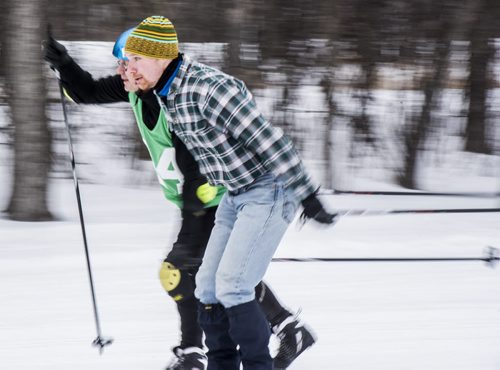 DAVID LIPNOWSKI / WINNIPEG FREE PRESS  Malcolm McPherson (right) of the National Leasing Hot Axes team is neck and neck with Allan of the HTFC Scarifiers team during the Get Off Your Butt and Ski event at Windsor Park Nordic Centre Saturday February 20, 2016.