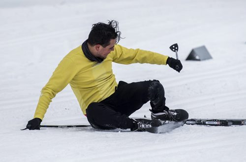 DAVID LIPNOWSKI / WINNIPEG FREE PRESS  Pablo Batista of the 5468796 Architecture team takes a spill during the Get Off Your Butt and Ski event at Windsor Park Nordic Centre Saturday February 20, 2016.