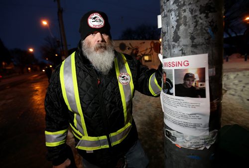 TREVOR HAGAN / WINNIPEG FREE PRESS Mitch Bourbonniere leads the Bear Clan as they search the North End for Cooper Nemeth, the missing 17 year old, Saturday, February 20, 2016.