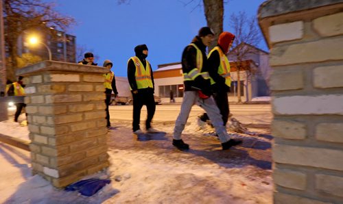 TREVOR HAGAN / WINNIPEG FREE PRESS Mitch Bourbonniere leads the Bear Clan as they search the North End for Cooper Nemeth, the missing 17 year old, Saturday, February 20, 2016.