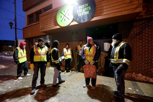 TREVOR HAGAN / WINNIPEG FREE PRESS Mitch Bourbonniere, right, leads the Bear Clan as they search the North End for Cooper Nemeth, the missing 17 year old, Saturday, February 20, 2016.