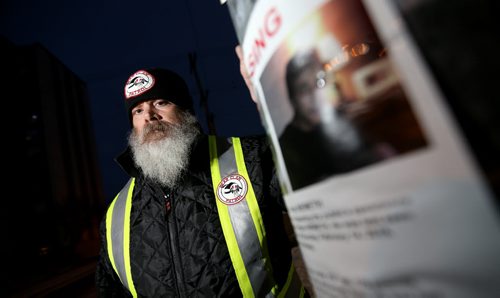 TREVOR HAGAN / WINNIPEG FREE PRESS Mitch Bourbonniere leads the Bear Clan as they search the North End for Cooper Nemeth, the missing 17 year old, Saturday, February 20, 2016.