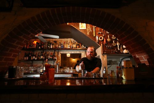 TREVOR HAGAN / WINNIPEG FREE PRESS Erik Thordarson pours drinks at Sous Sol in Osborne Village, Saturday, February 20, 2016. For Bartley restaurant review.