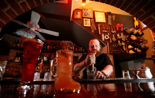 TREVOR HAGAN / WINNIPEG FREE PRESS Erik Thordarson makes a Sous Sol'd Fashioned at Sous Sol in Osborne Village, Saturday, February 20, 2016. For Bartley restaurant review.