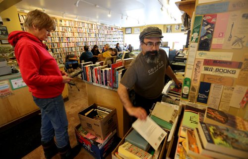 TREVOR HAGAN / WINNIPEG FREE PRESS Bill Fugler, right, owns the Neighbourhood Book Store & Café, Saturday, February 20, 2016. For THIS CITY - Dave Sanderson