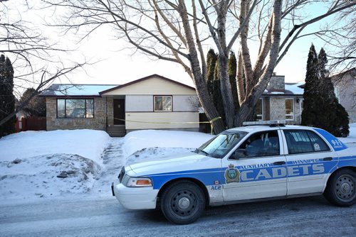 MIKE DEAL / WINNIPEG FREE PRESS Outside number 10 Bayne Crescent early Sunday morning. Police tape and a couple of police cadets vehicles are the only sign that Cooper Nemeth's body was located late Saturday night nearby.  160221 February 21, 2016