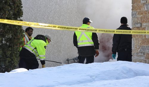 MIKE DEAL / WINNIPEG FREE PRESS City crews arrive to help with the investigation outside number 10 Bayne Crescent Sunday morning. Police are melting snow looking for evidence near where Cooper Nemeth's body was located late Saturday night.  160221 February 21, 2016