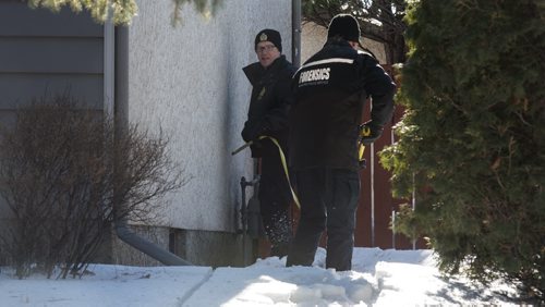 MIKE DEAL / WINNIPEG FREE PRESS Winnipeg Police forensics officers outside number 10 Bayne Crescent Sunday morning. Police are looking for evidence near where Cooper Nemeth's body was located late Saturday night. 160221 - Sunday, February 21, 2016