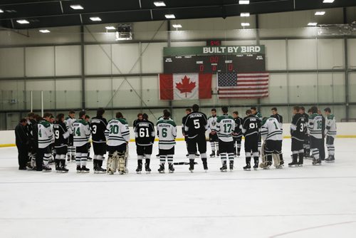JOHN WOODS / WINNIPEG FREE PRESS With his team jersey in the middle, members of the River East Marauders and the Lord Selkirk/Seven Oaks Rebels gather at centre ice before their game to remember Cooper Nemeth Sunday , February 21, 2016. Nemeth, who was murdered, was found Saturday.
